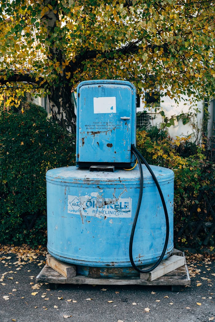 A blue gas pump sitting on a pallet